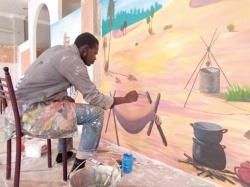 عبد الجبار مومني يروي حكايات تراث مدينة توات في جداريات